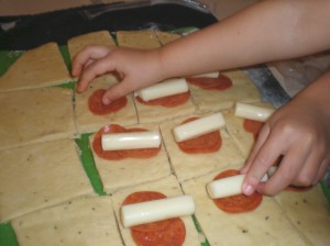 My kids helping me make Stuffed Bread Sticks