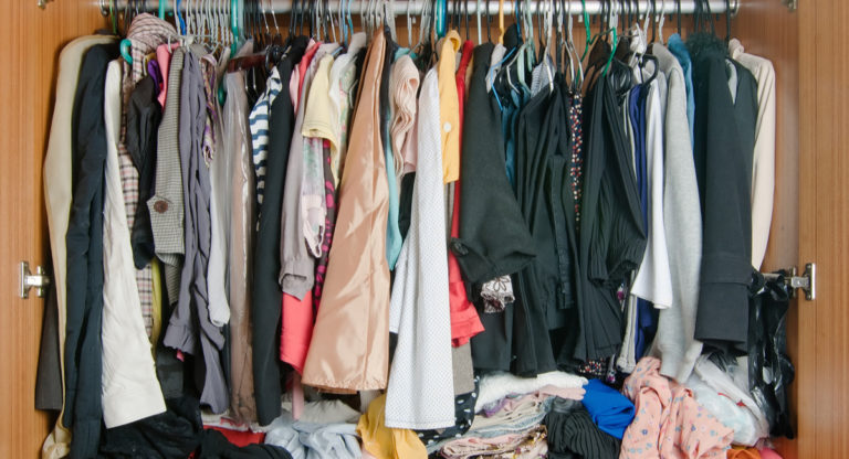 closet space, clothes hanging in closet