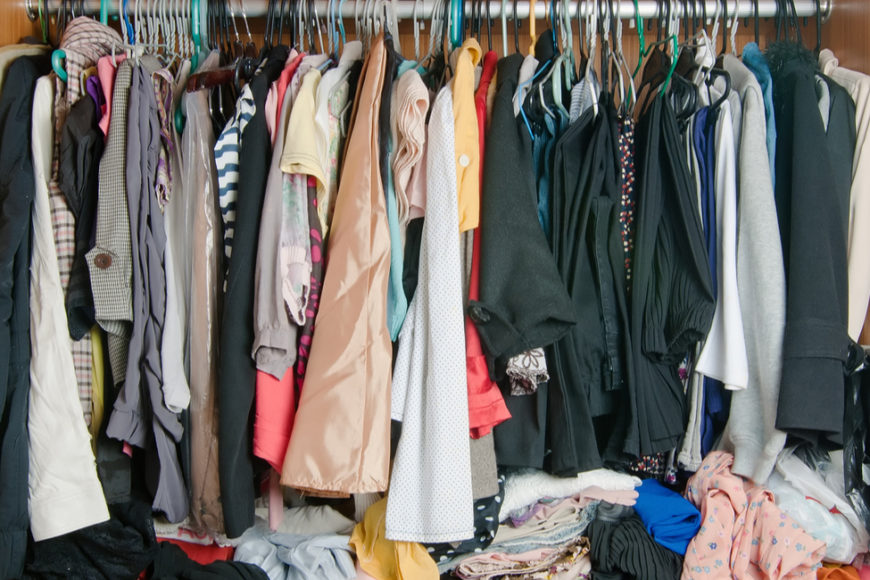 closet space, clothes hanging in closet