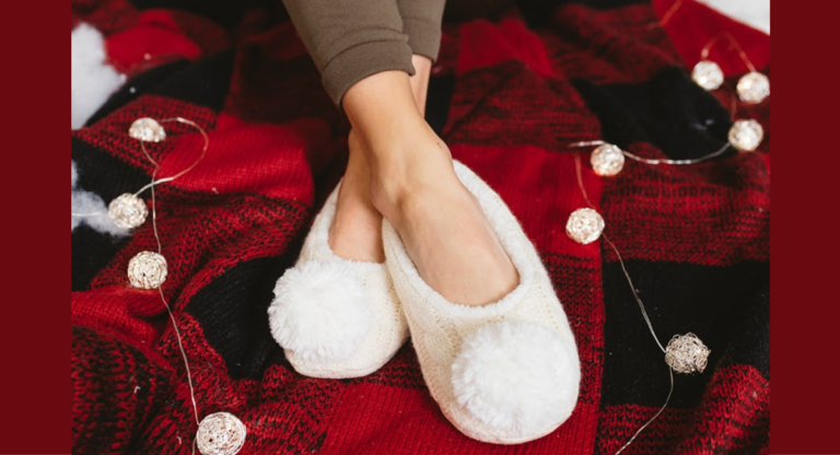 cozy white slippers on red and black buffalo plaid blanket